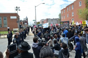 Protest at the Baltimore Police Department Western District building at N. Mount St. and Riggs Ave. Photo credit: Veggies, Wikimedia Commons.