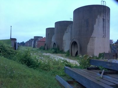 Twenty cylindrical concrete sand bins are the most visible element inside the McMillan Sand Filtration Site. Photo credit: David Rotenstein.