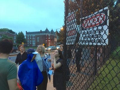 Activists gather outside McMillan Sand Filtration Site fence before entering at dusk on July 4, 2016. Photo credit: David Rotenstein.