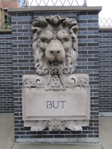 lion head and word "but"