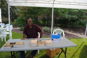 Joshua Trower works a table at the Country Doctor Museum in Bailey, North Carolina to provide outreach for the Pope House Museum, under the City of Raleigh Museum, in Raleigh, NC. 