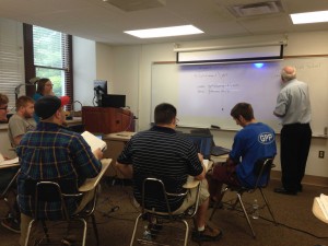 Jim McFarland, volunteer at GPHS, briefs Dr. Black’s students on the GPHS scanning project in May 2015.  Image courtesy of Ron Faraday, Greater Pittston Historical Society.