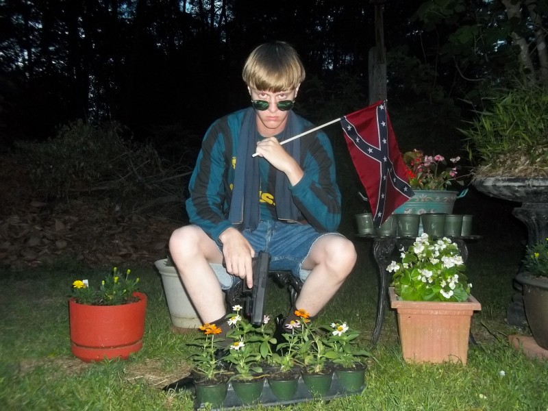 Dylann Roof posing with confederate flag and gun. Photo originally from white supremacist website, posted on NYTimes.com