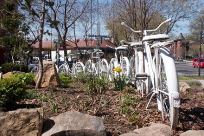 Bicycle art installation, Rhode Island Avenue NW. The landmark “Bloomingdale” liquor store sign is visible in the background. Photo credit: David Rotenstein.
