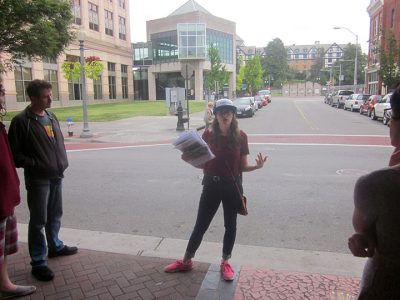 Rachel Barton tells the story of transvestite sex workers who used to work on this block in Roanoke, Virginia, as part of the Southwest Virginia LGBTQ+ History Project's Downtown Roanoke LGBTQ History Walking Tour, September 25, 2016. Photo credit: Photograph by the author.