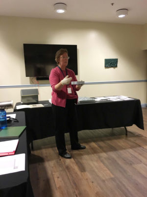 Karen Whitehair talking about collections management tools such as acid-free boxes. (Photo courtesy of Gary Dyson of the Frederick County Civil War Roundtable)