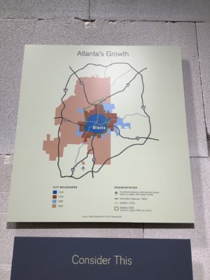 Exhibit panel showing Atlanta's growth over time above a panel reading "Consider This"