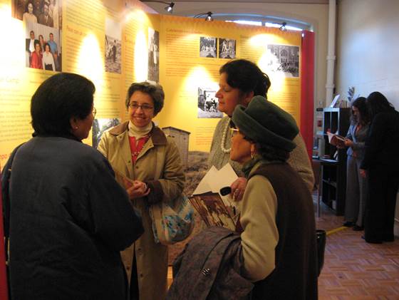 This image depicts visitors viewing the the West Chicago City Museum's exhibit "Creating Mexican American Identities: Multiple Voices, Shared Dreams."