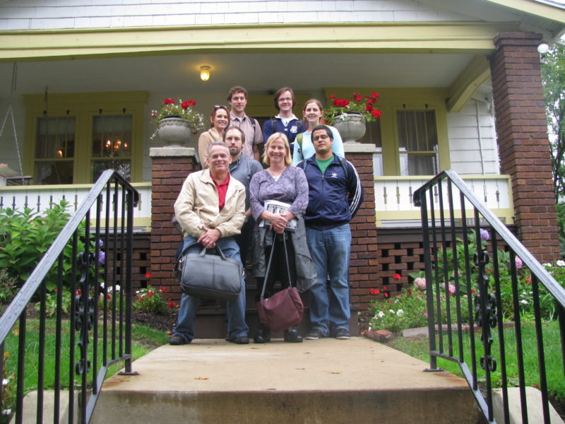 University of Michigan students and museum board member in front of the Dr. Bob and Anne Smith Home, Akron, Ohio during the NHL designation ceremony.