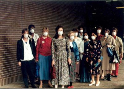 A group of workers wearing face masks