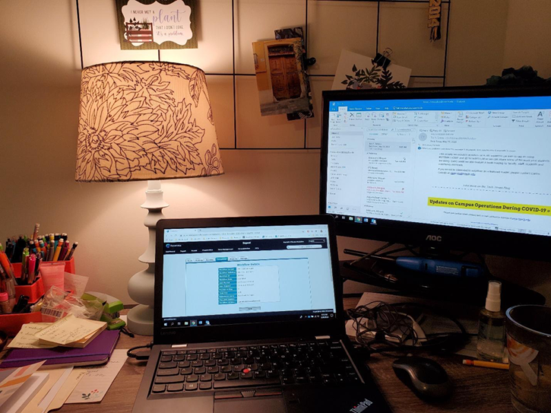 This is a color photograph of a makeshift work from home space in the corner of my apartment bedroom. The laptop screen shows a stage in the web crawling process in Preservica, the Archives’s digital preservation software.