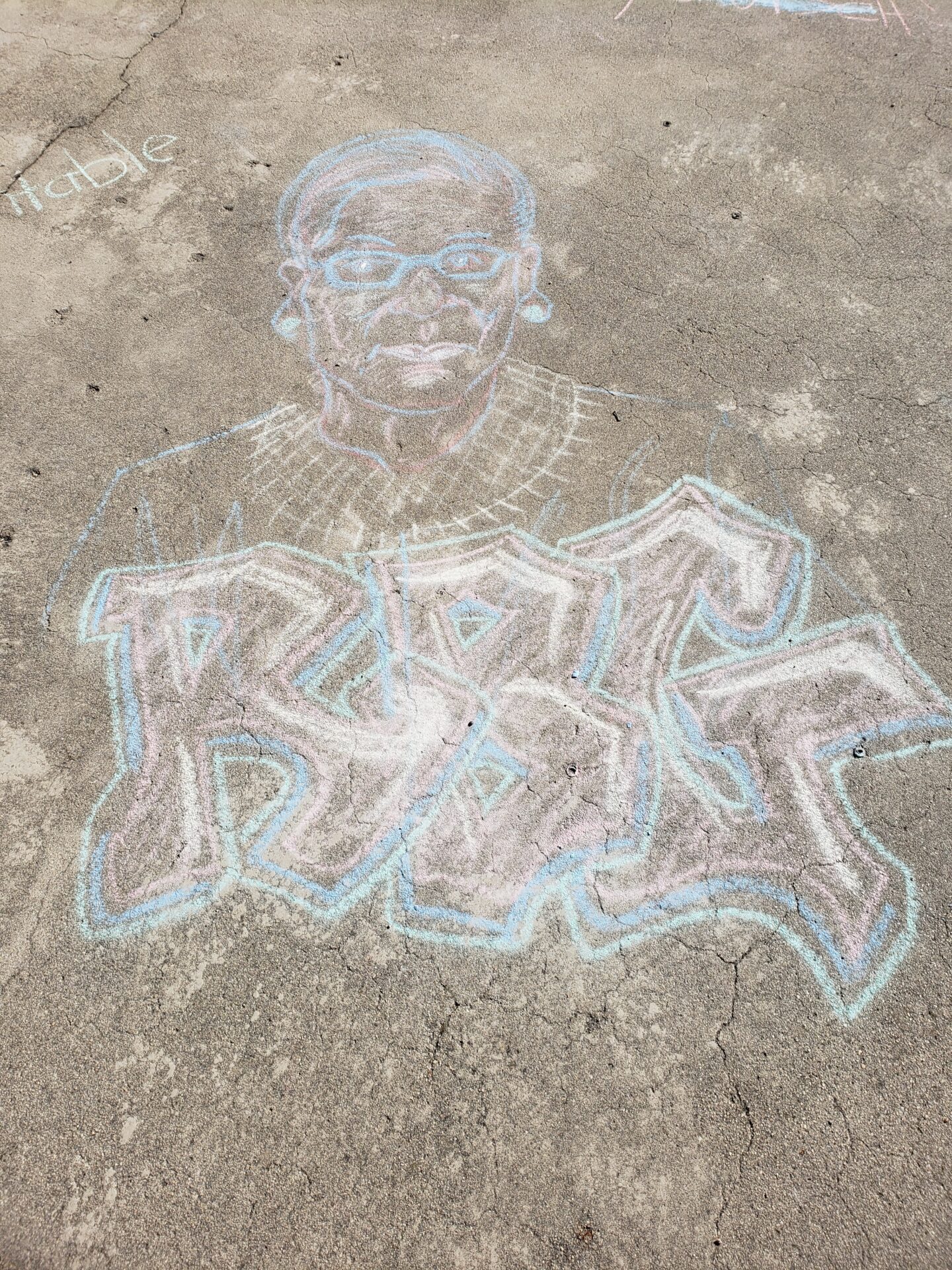 A chalk drawing of Ruth Bader Ginsburg drawn outside the Old Idaho Penitentiary by a visitor. Photo by Hayley Noble.