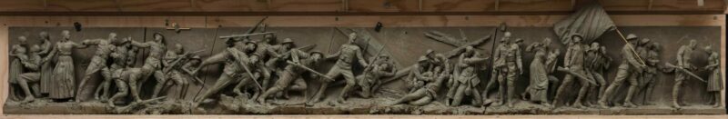 Sculpture of men engaged in warfare during World War I