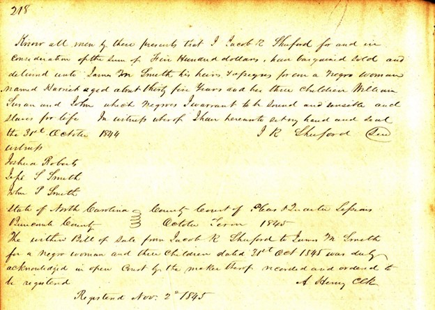 An 1845 deed for the sale of a 35-year-old enslaved woman named Harriett and her three children William, Susan, and John.