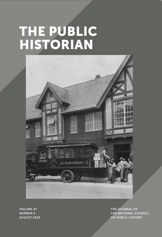 The journal cover features a black and white image of a truck in front of a tudor-style grocery store.