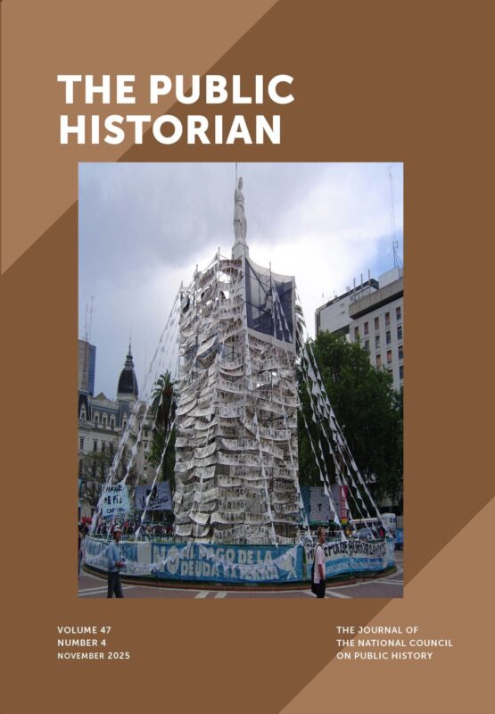 Full view of the May Pyramid surrounded by scaffolding wrapped in bannersmade from individual photographs of disappeared persons. The more than twenty-five rows of black and white photos create a visual representation of the extent of the crimes and put human faces to the disappeared.