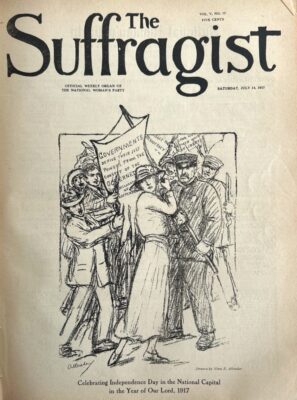 Cover of the magazine the Suffragist from July 14, 1917 featuring a black and white cartoon of a woman surrounded by a mob of men. She is holding a banner that reads: "Governments derive their just powers from the consent of the governed." The cartoon is captioned: "Celebrating Independence Day in the National Capital in the Year of Our Lord, 1917."